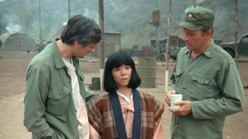 Alan Alda, Larry Linville, and Saachiko in M*A*S*H (1972)
