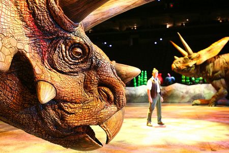 Still shot of JB with both torosaurus's Walking With Dinosaurs, Madison Square Garden.