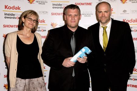 Michael James Rowland, Nial Fulton and Corrie Soeterboek pose with the award for Best Documentary for film The Last Conf