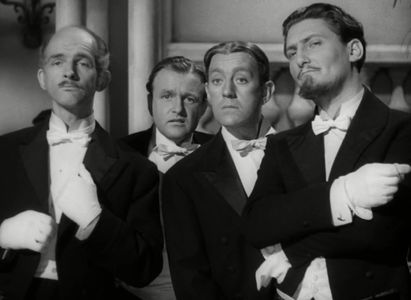 Alec Guinness, Peter Copley, and Andrew Faulds in The Promoter (1952)