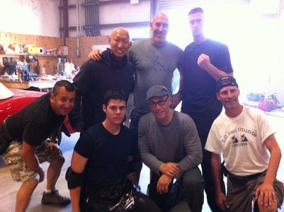 Lloyd Pitts along side Jean-Claude Van Damme, director John Hyams, and some of the Dragon Eyes Stunt team.