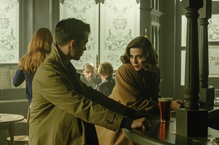 Jack Bannon and Emma Paetz in Pennyworth (2019)