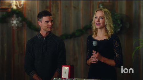 Colin Egglesfield and Cassie Kramer in A Christmas Witness (2021)
