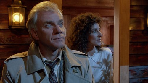 Malcolm McDowell and Madolyn Smith Osborne in The Caller (1987)