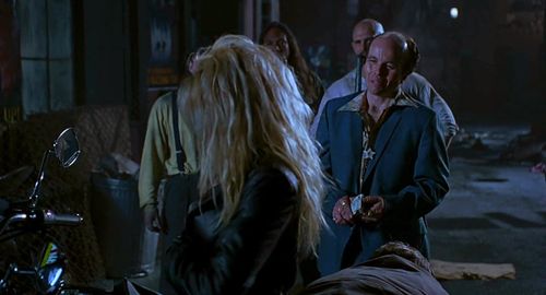 Pamela Anderson and Clint Howard in Barb Wire (1996)