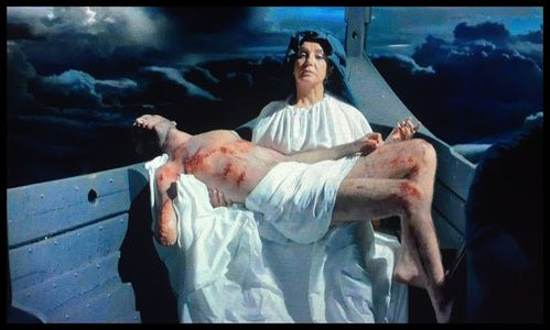 Pieta - Artin John disfigured scarred and wounded, lying on his mothers lap. X Files