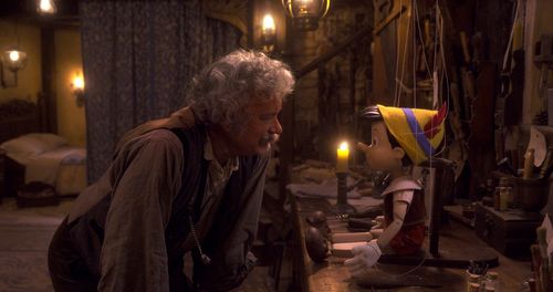 Tom Hanks and Benjamin Evan Ainsworth in Pinocchio (2022)