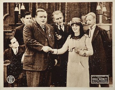 Roscoe 'Fatty' Arbuckle, Glen Cavender, Ted Edwards, and Mabel Normand in That Little Band of Gold (1915)