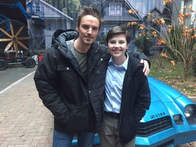 Dodge and actor, Riley Smith, on the set of Frequency