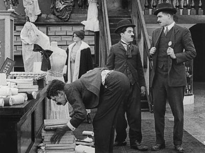 Charles Chaplin, Albert Austin, and Tom Nelson in The Floorwalker (1916)