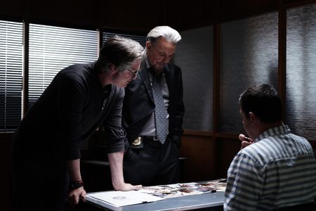 Director Adam Cooper with actor Tommy Flanagan on the set of SLEEPING DOGS