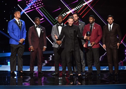 NFL player Julian Edelman (C) and teammates accept the Best Game award for Super Bowl LI (Patriots vs. Falcons) onstage 