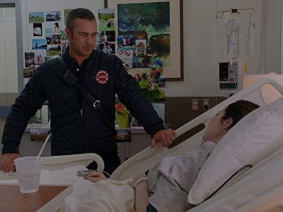 Charlotte Sullivan and Taylor Kinney in Chicago Fire (2012)