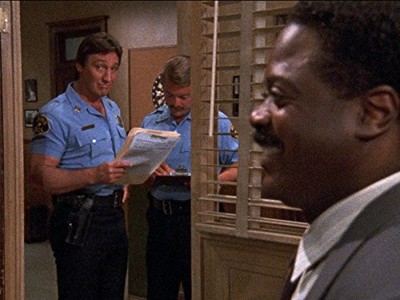 Alan Autry and Howard E. Rollins Jr. in In the Heat of the Night (1988)