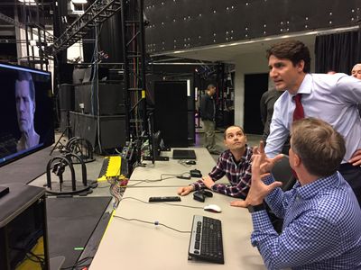 Prime Minister Trudeau admiring EA Games Project featuring Drummond Macdougall's Digital Image.