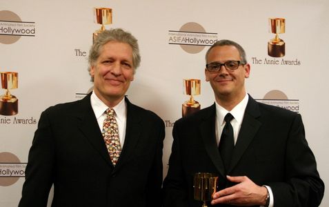 Presenter Clancy Brown with Warner Bros. Animation president Sam Register, accepting the Winsor McCay award on behalf of