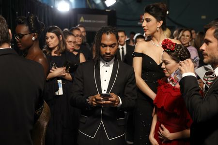 Gael García Bernal, Natalia Lafourcade, Lupita Nyong'o, and Miguel at an event for The Oscars (2018)