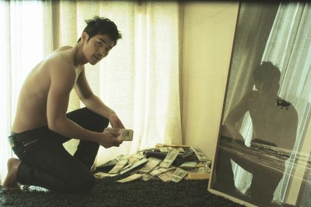 Kang-woo Kim in The Taste of Money (2012)