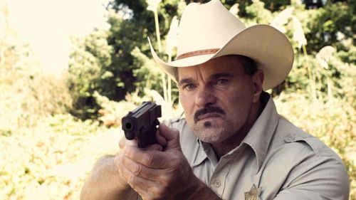 CARL BAILEY AS SHERIFF ROY KEEPS.
