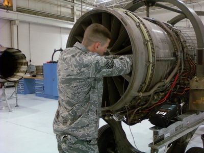 James Burleson is performing what's called a midspan inspection on the engine of an F-16 using an electronic testing met