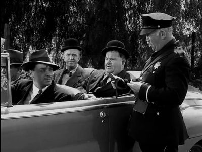 Oliver Hardy, James Bush, Edgar Dearing, Stan Laurel, and Philip Van Zandt in The Big Noise (1944)