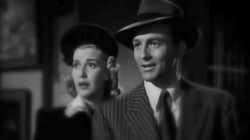 Michael Duane and Anita Louise in The Devil's Mask (1946)