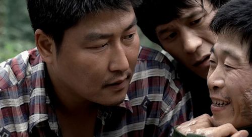 Song Kang-ho, Roe-ha Kim, and No-shik Park in Memories of Murder (2003)