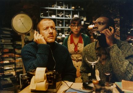 Dany Boon, Omar Sy, and Marie-Julie Baup in Micmacs (2009)
