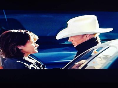 Michelle Rios (Flora) and Ed Harris (Roy) in a scene from 