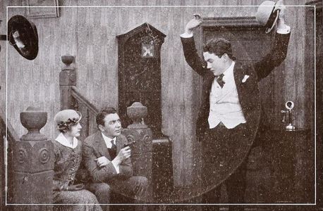 Marguerite Courtot, Joe Moore, and Tom Moore in For High Stakes (1915)