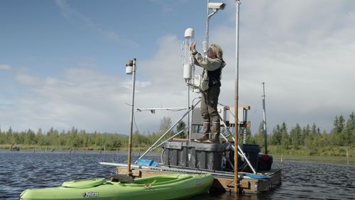 Methane ecologist Dr Katey Walter Anthony checks measurements in Alaska with the crew of Back to Our Future: Climate Res