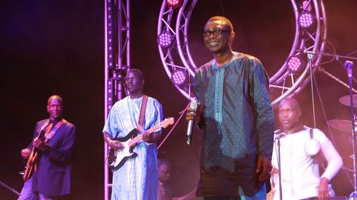 Youssou N'dour and band on stage in Senegal filmed for 