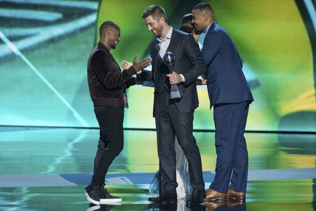 Usher, Aaron Rodgers, and Richard Rodgers