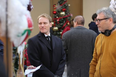 Nicholas Banks and director Peter Hewitt on set for Hallmark's CHRISTMAS AT THE PALACE