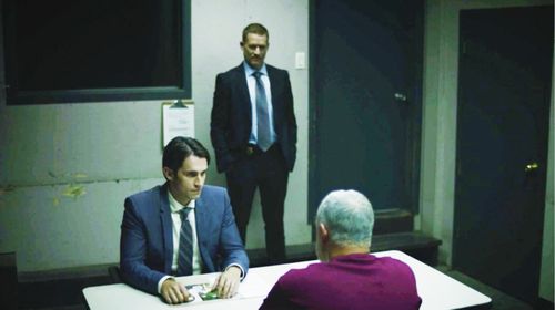 Notorious serial killer Bruce McArthur (Dave Rose) is interrogated by Det. David Dickinson (Richard de Klerk) under the 