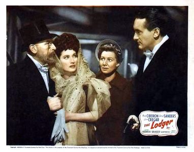 George Sanders, Cedric Hardwicke, Queenie Leonard, and Merle Oberon in The Lodger (1944)