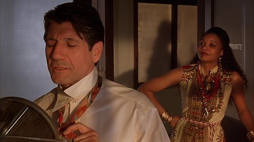 Arnetia Walker and Fred Ward in Cast a Deadly Spell (1991)