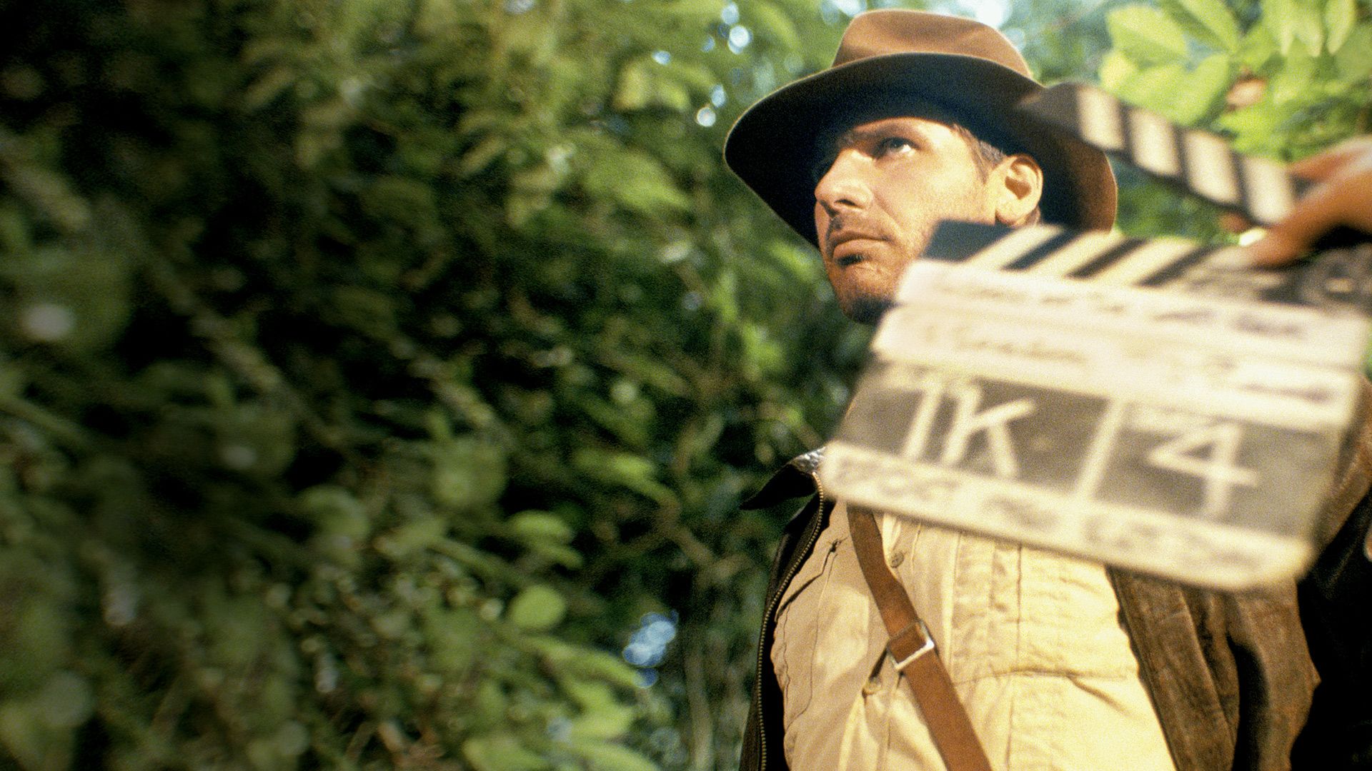 Timeless Heroes: Indiana Jones and Harrison Ford background