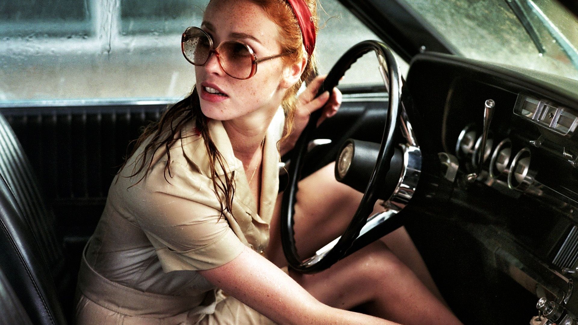 The Lady in the Car with Glasses and a Gun background
