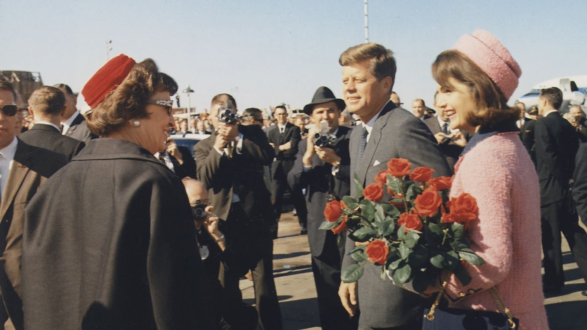 JFK Revisited: Through the Looking Glass background