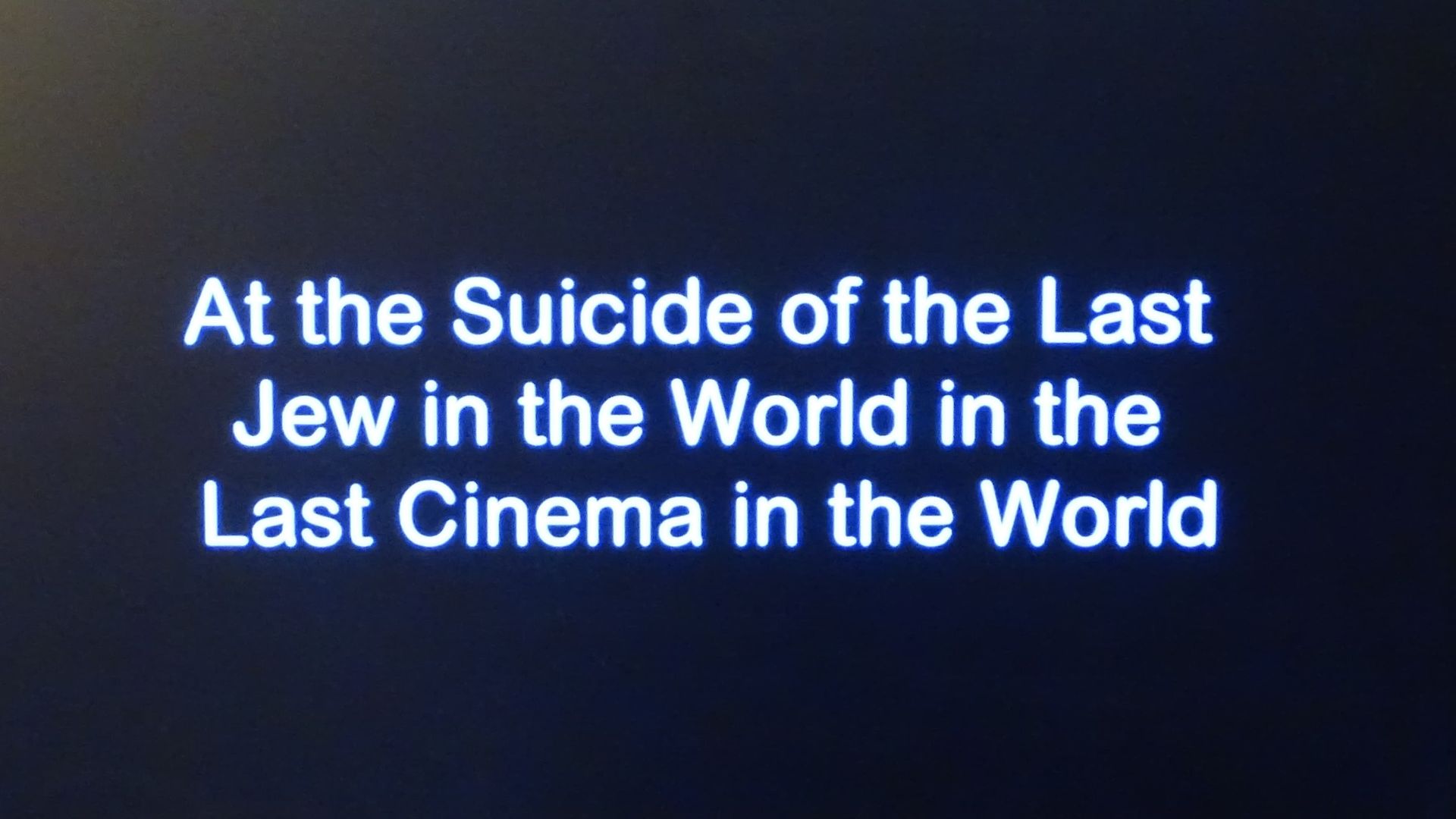 At the Suicide of the Last Jew in the World in the Last Cinema in the World background