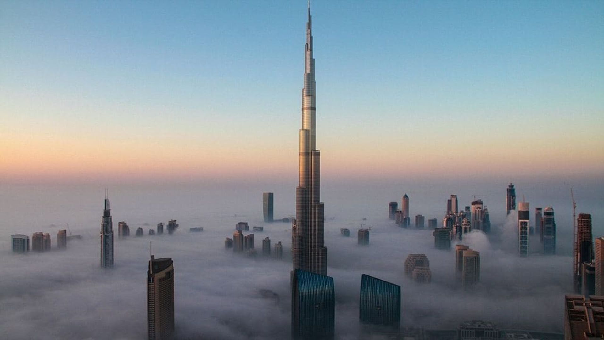 World's Tallest Skyscrapers: Beyond the clouds background