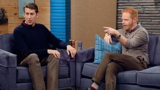 Episode 8 Jesse Tyler Ferguson Wears a Brown Checked Shirt and Stripey Socks